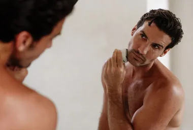 A man shaving with a panasonic razor