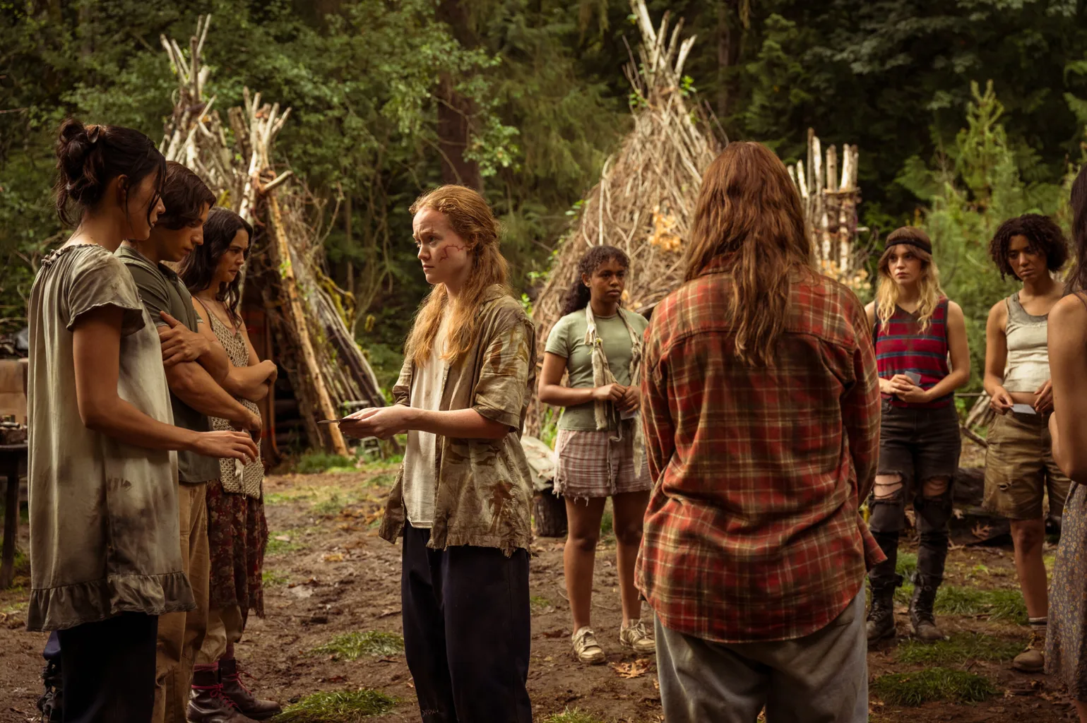 Alexa Barajas as Teen Mari, Kevin Alves as Teen Travis, Courtney Eaton as Teen Lottie, Liv Hewson as Teen Van, Silvana Estifanos as Teen Britt, Sophie Thatcher as Teen Natalie and Jasmin Savoy Brown as Teen Taissa in Yellowjackets, episode 5, season 3.