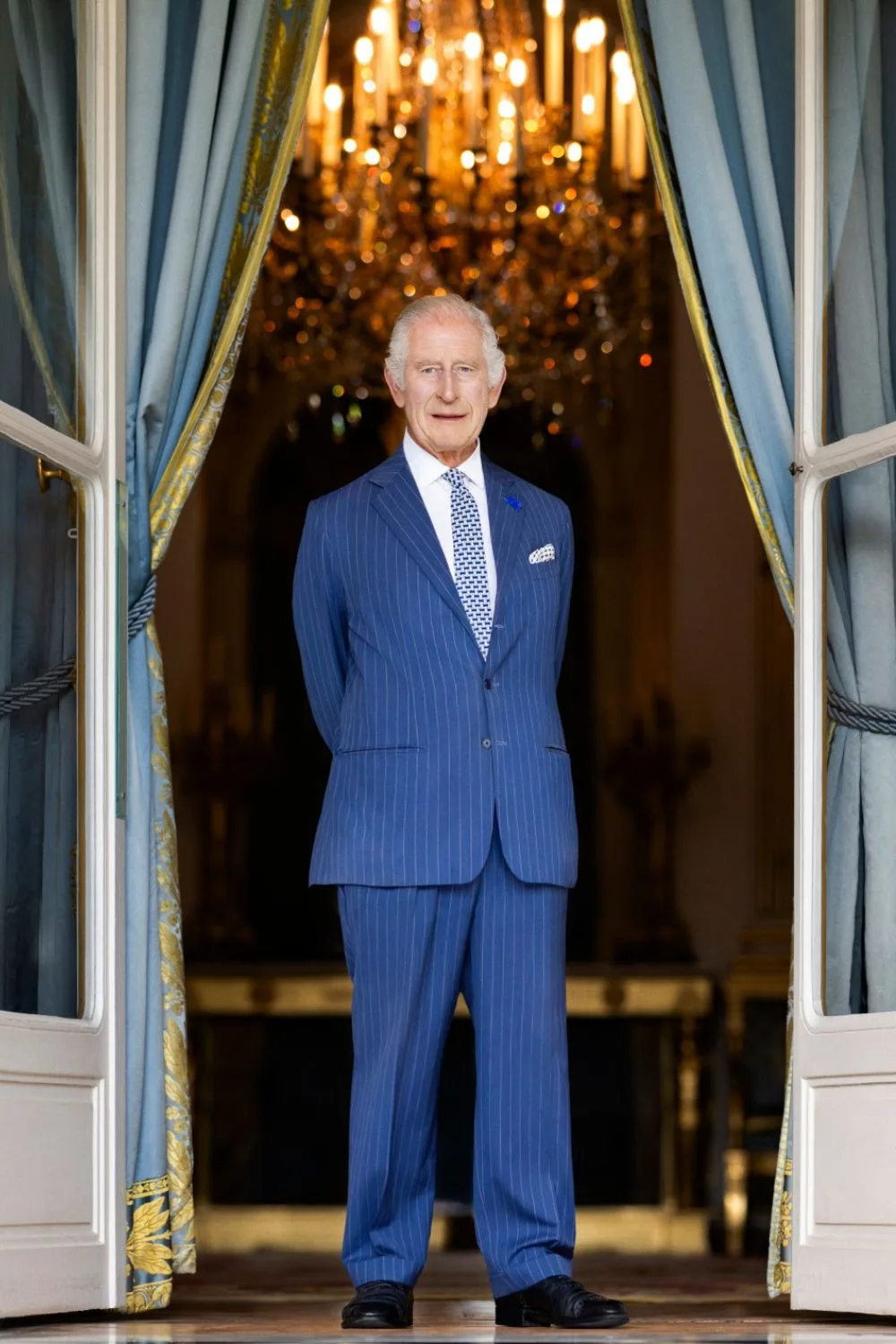 King Charles posing in a doorway 