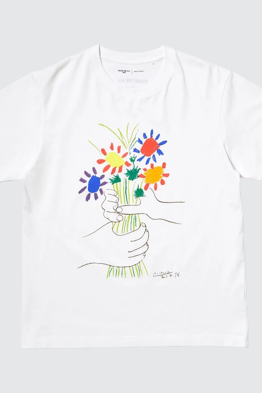 Uniqlo Peace for All Charity t-shirt that shows hands holding a bouquet of flowers