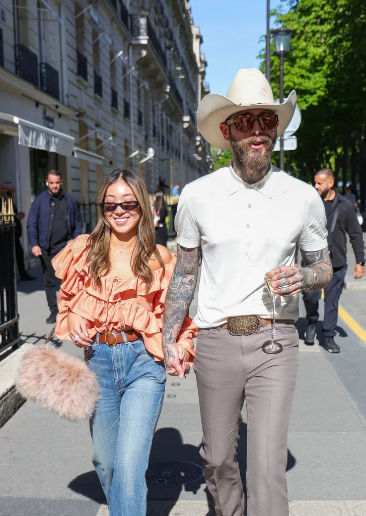 AU_3202230 - Paris, FRANCE - Stylish couple Post Malone and Christy Lee take a stroll down Avenue Montaigne during a romantic weekend in Paris, France.
