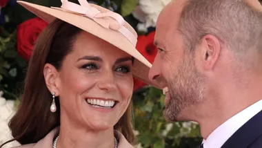 The princess of wales lookings lovingly at Prince William