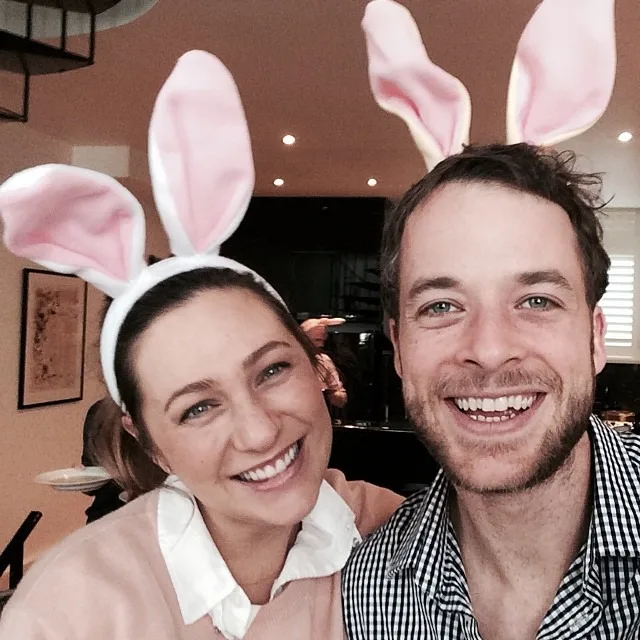 Hamish Blake and Zoe Foster Blake posing for a selfie with bunny ears at a family Easter celebration