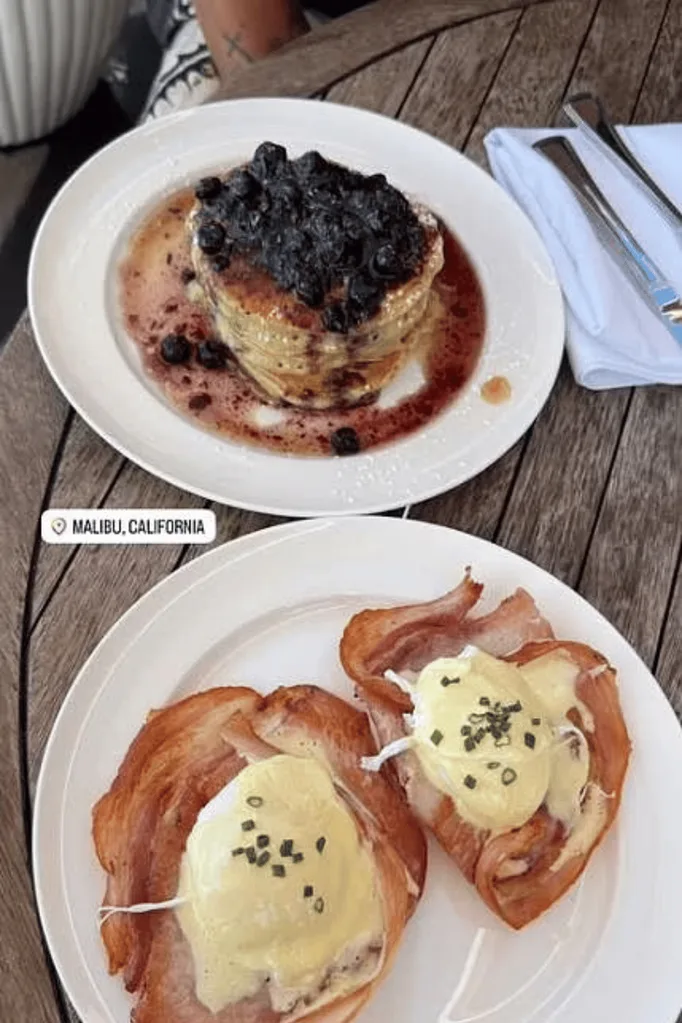 A plate of pancakes on a cafe table.