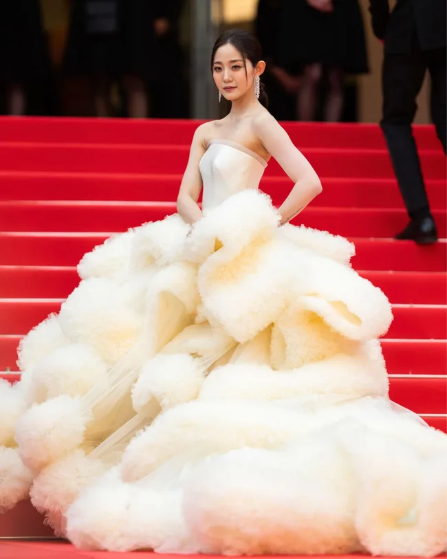 wan qianhui wears a voluminous layered yellow dress at cannes film festival 2025
