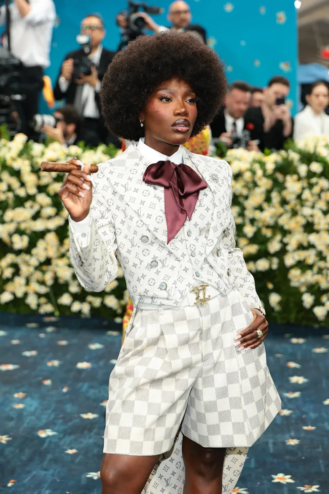 Doechii in a white blouse with a bow at the Met Gala.
