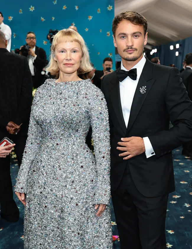 NEW YORK, NEW YORK - MAY 05: (L-R) Pamela Anderson and Brandon Thomas Lee attend the 2025 Met Gala Celebrating "Superfine: Tailoring Black Style" at Metropolitan Museum of Art on May 05, 2025 in New York City. (Photo by Dimitrios Kambouris/Getty Images for The Met Museum/Vogue)
