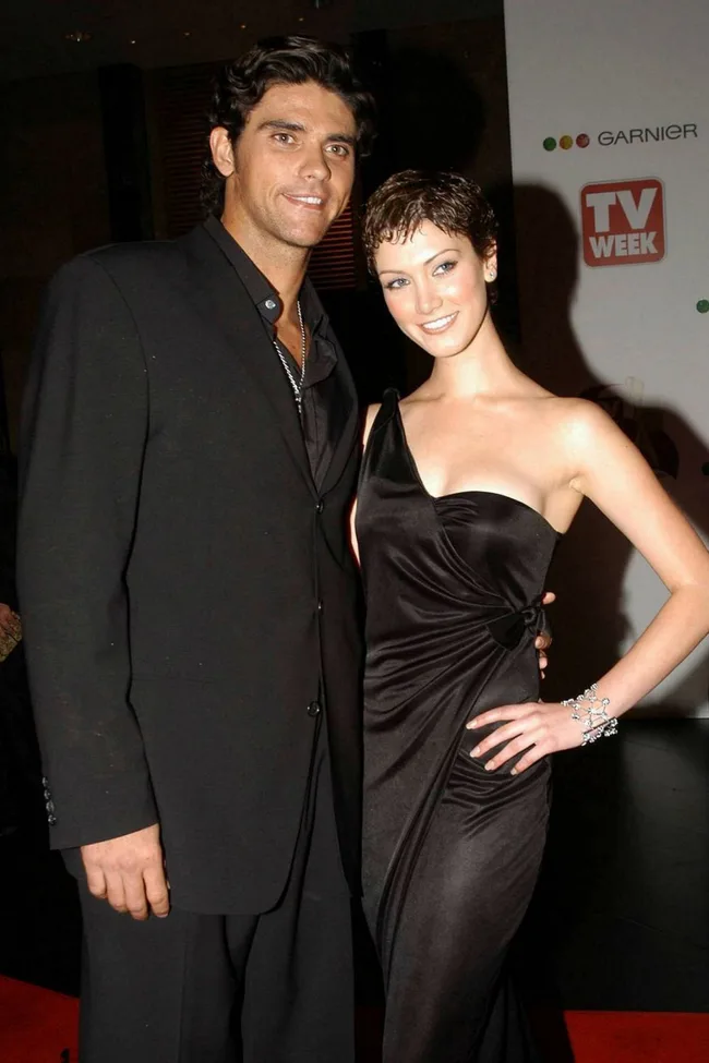 delta goodrem with boyfriend mark philippousis on logie awards red carpet wearing one shoulder black gown