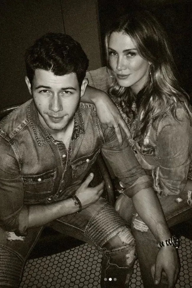 delta goodrem with ex boyfriend nick jonas in black and white photo