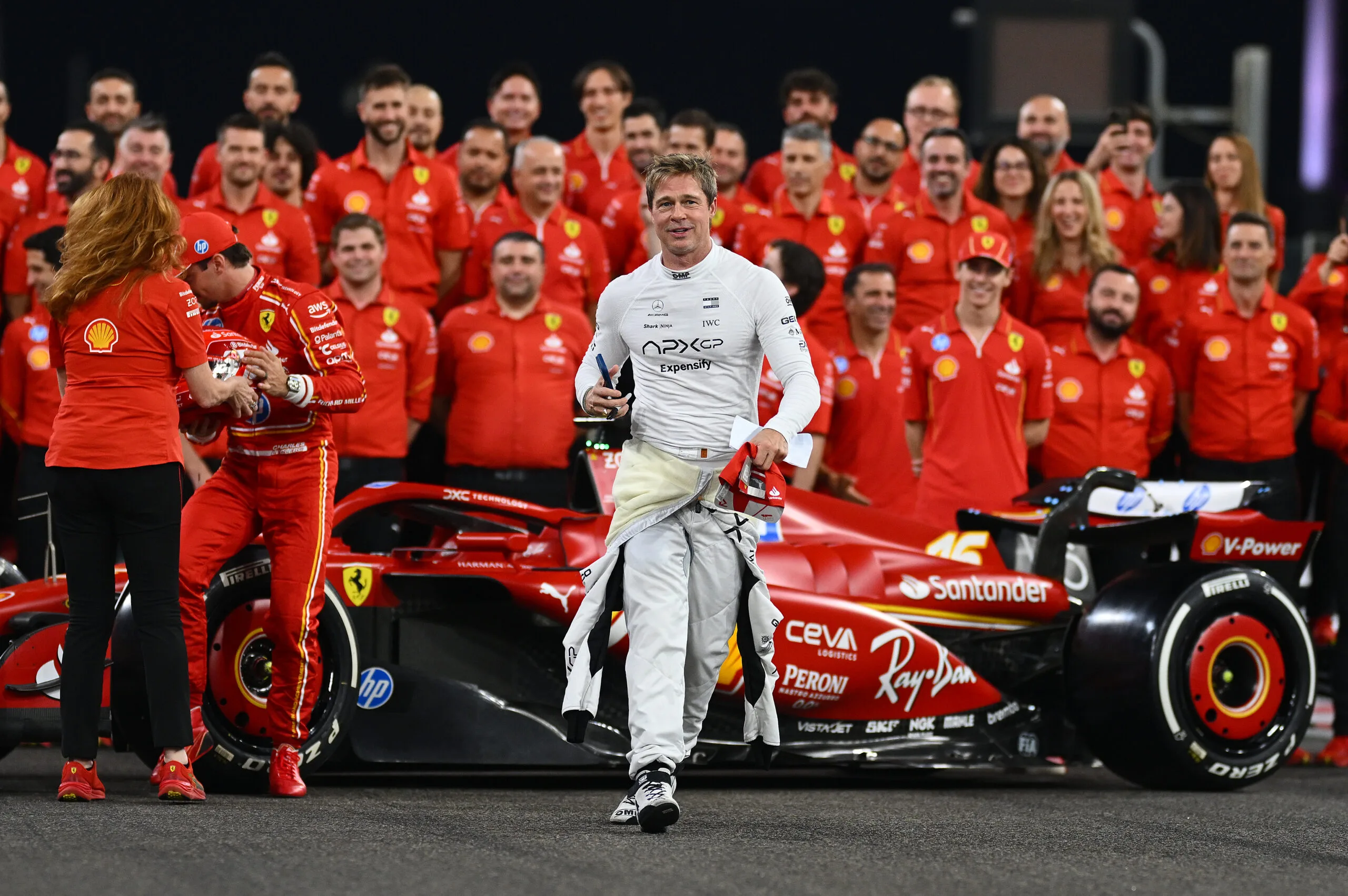 brad pitt with a formula 1 car and team