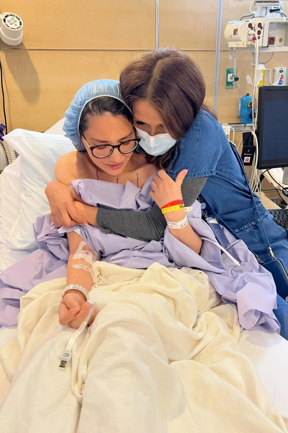Olivia Munn in a hospital bed facing cancer treatment