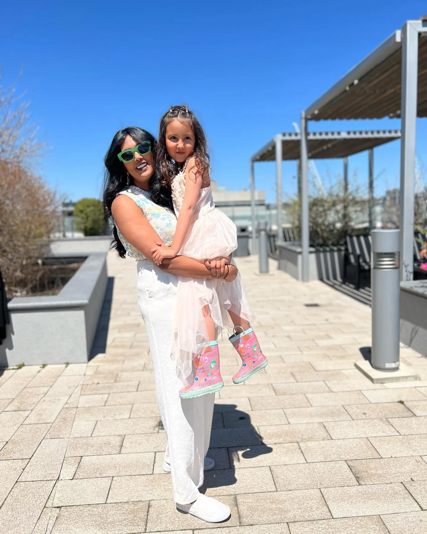 Nesh with her daughter in the sun