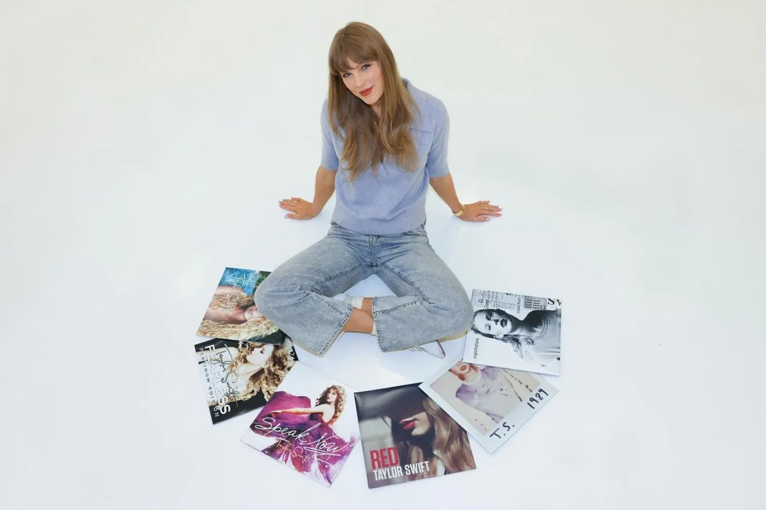 Taylor Swift with her albums