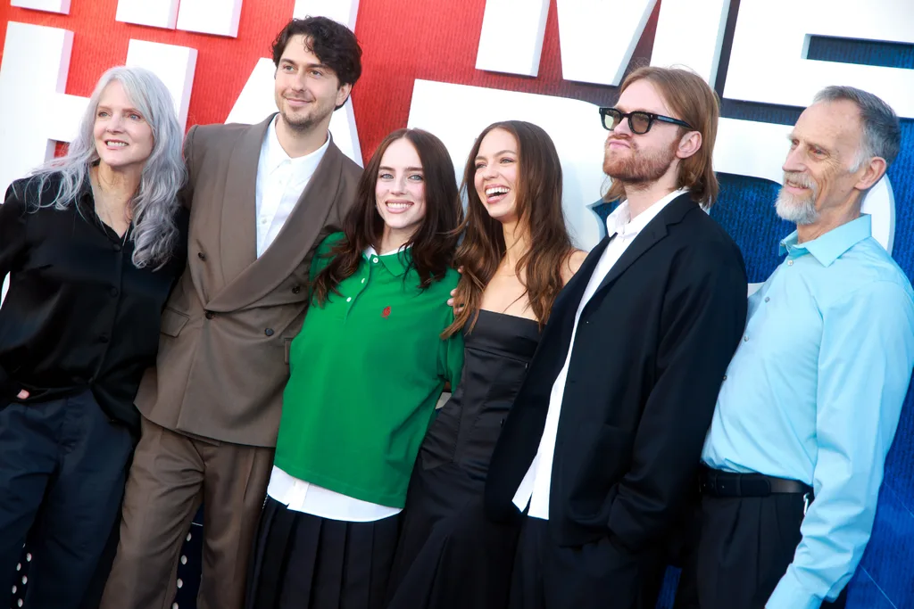 Billie Eilish and Nat Wolff made their relationship red carpet official by posing with their family at the 'Billie Eilish—Hit Me Hard and Soft: The Tour (Live in 3D)' LA premiere. Credit: Getty.