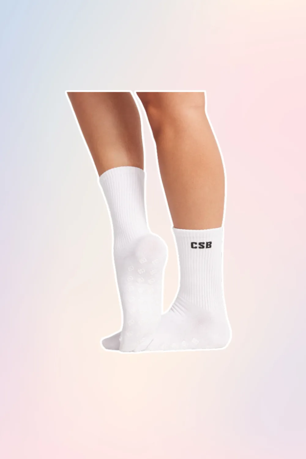 White Pilates grip socks with CSB in black print. 