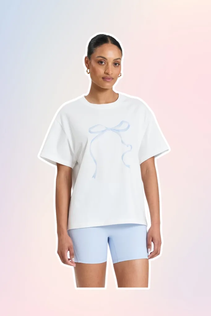 White t-shirt with blue bow.