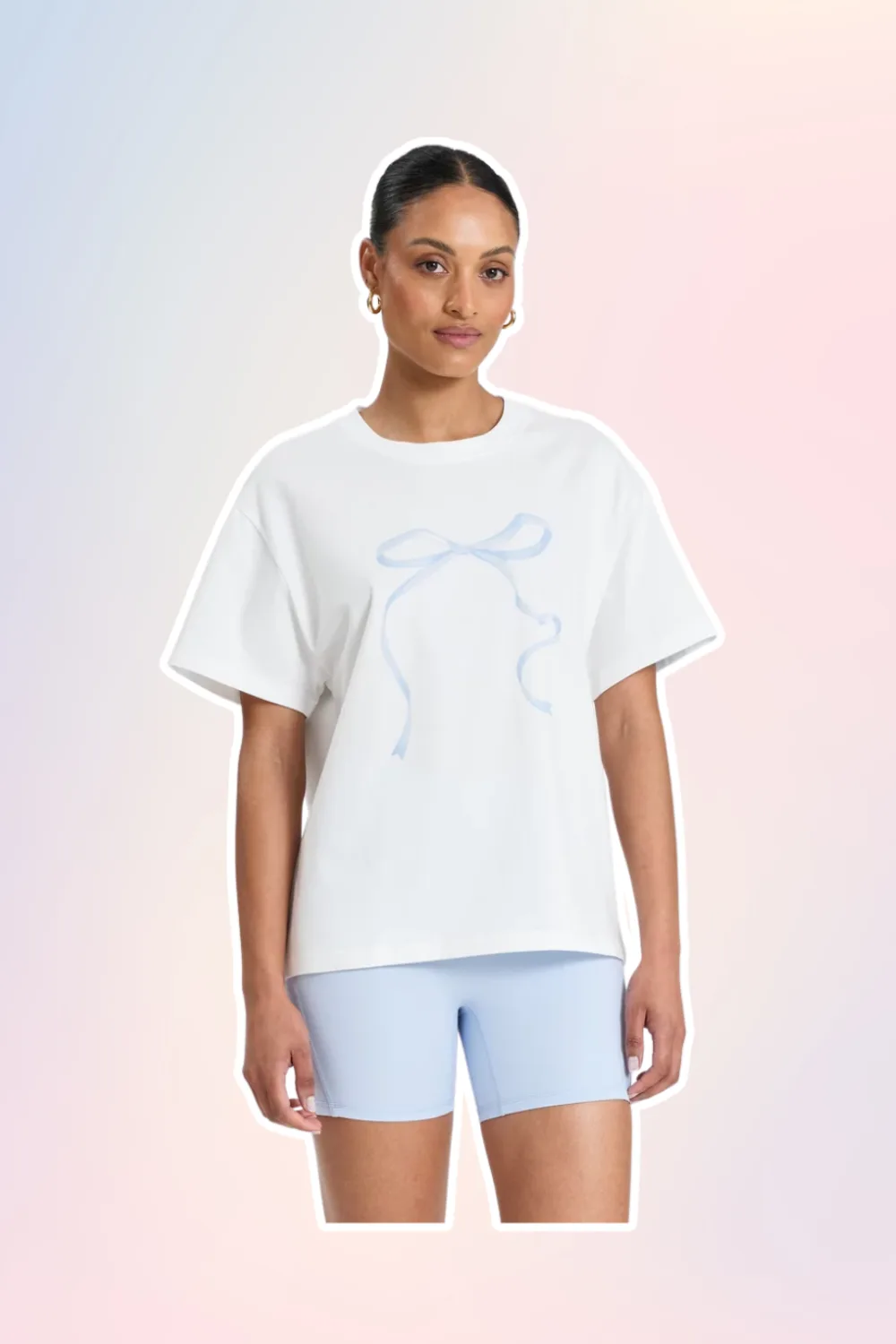 White t-shirt with blue bow.