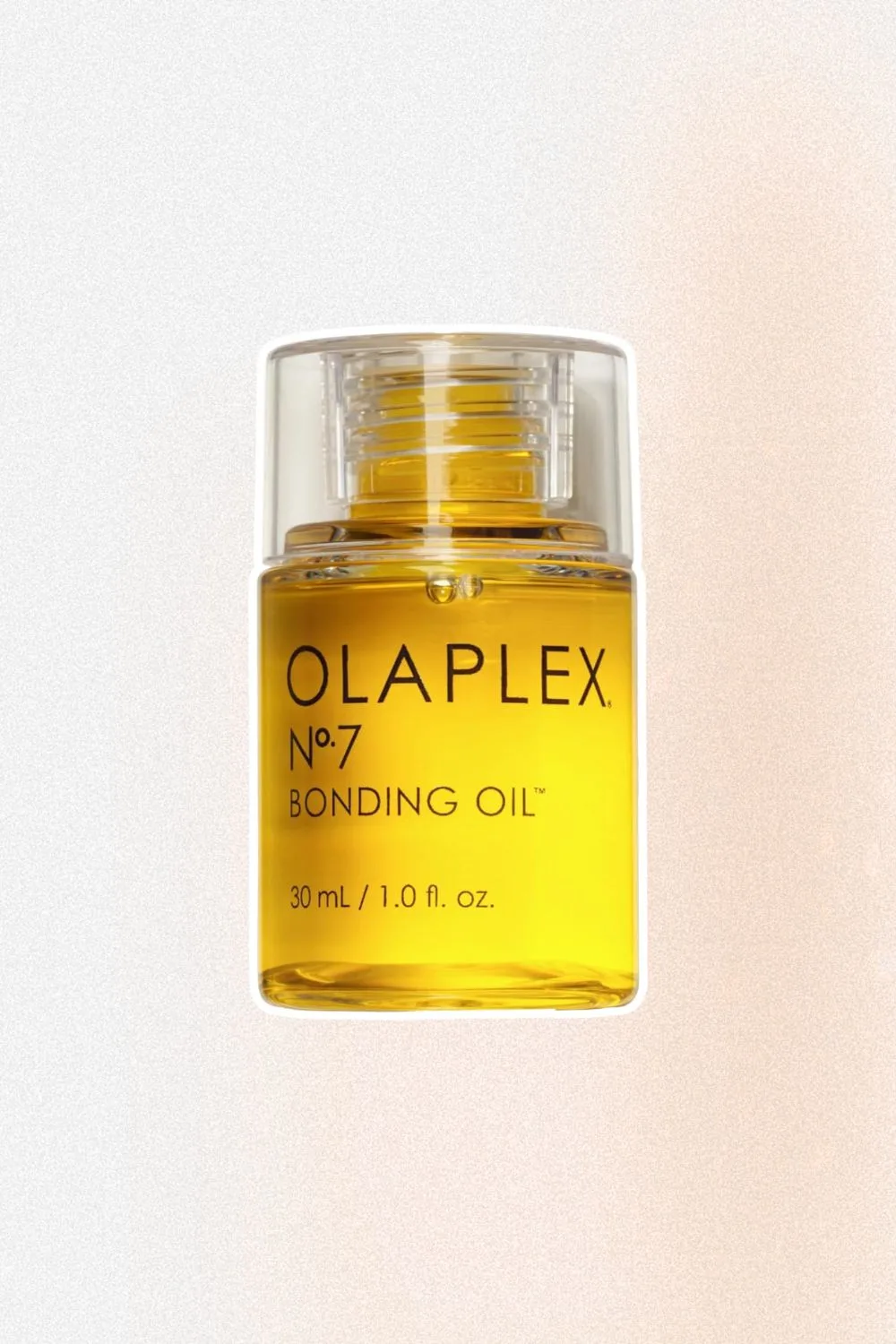 Short clear tube with yellow serum with label Olaplex No 7 Bonding oil on the front