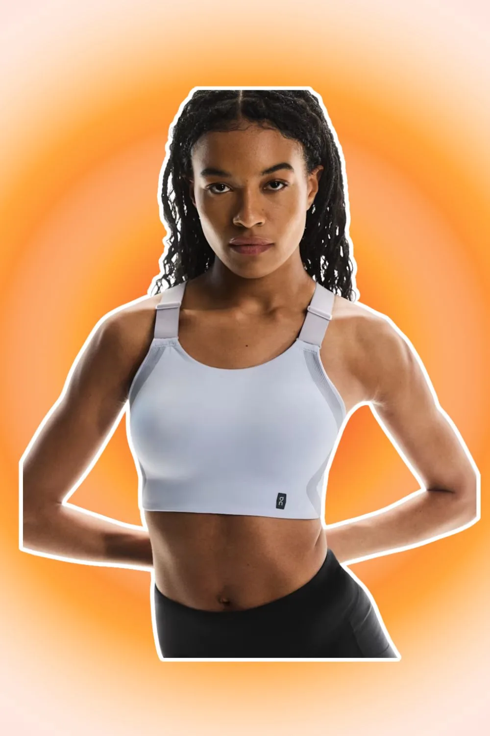 Woman with hair down wearing light great running sports bra. 