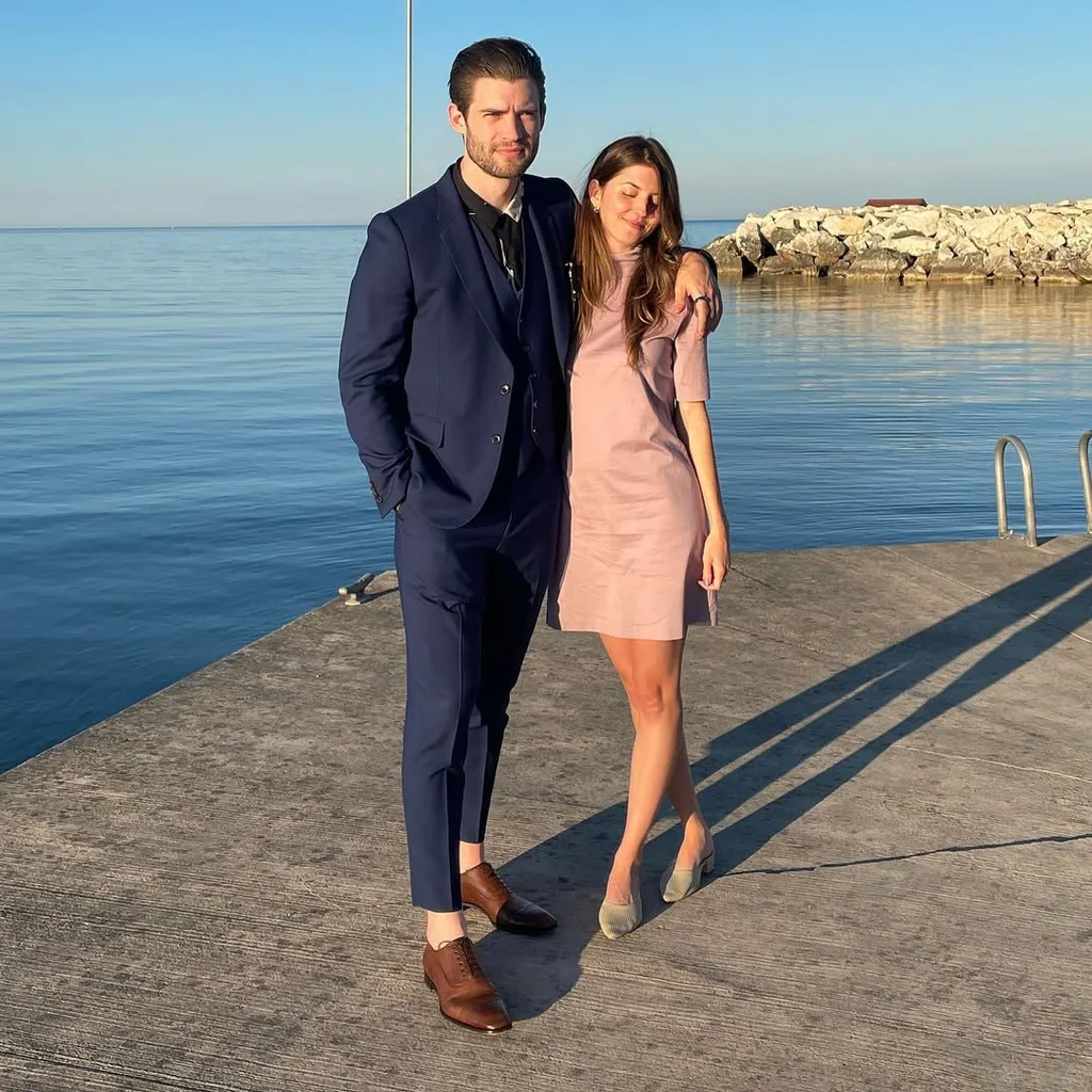 david corenswet and wife julia best warner pose for a photo by the sea at sunset in 2022