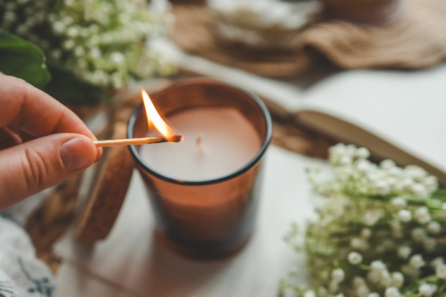 person lighting a candle