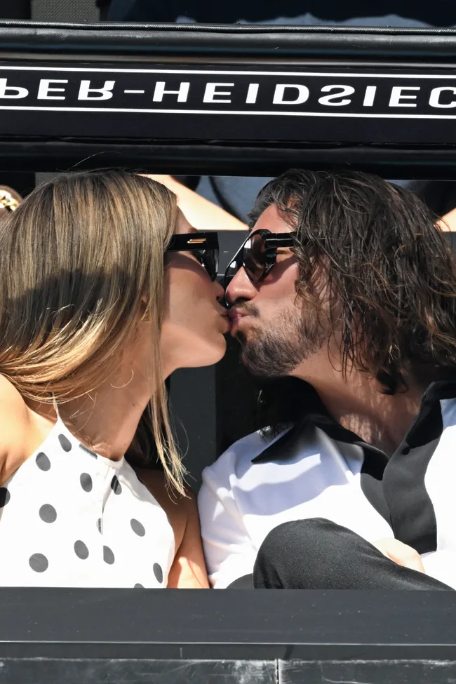 Delta Goodrem and Matthew Copley were snapped at the 2026 Australian Open during a sweet PDA moment. Credit: Getty