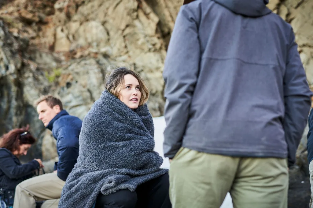 Rebecca Breeds wrapped up in blanket on set of Kangaroo Island