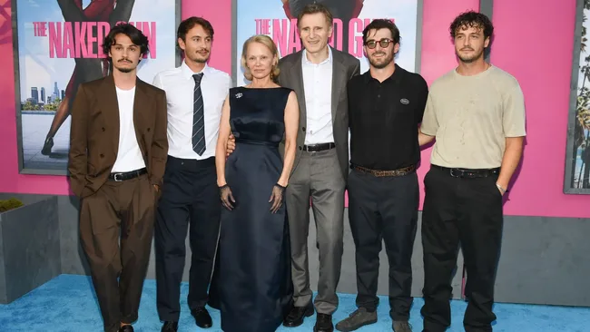 (L-R) Dylan Jagger Lee, Brandon Thomas Lee, Pamela Anderson, Liam Neeson, Daniel Neeson, and Micheál Neeson attend ‘The Naked Gun’ New York Premiere on July 28, 2025. Image: Getty