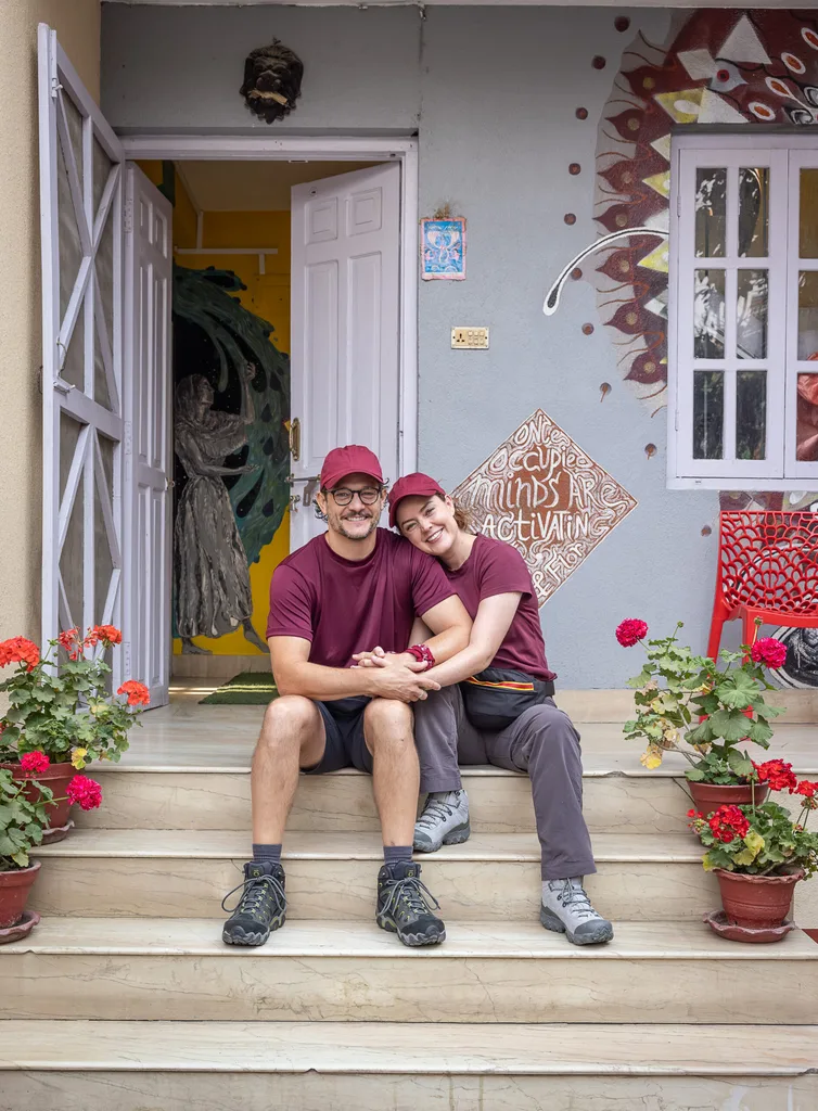 rob mills and georgie tunny sitting on stairs together
