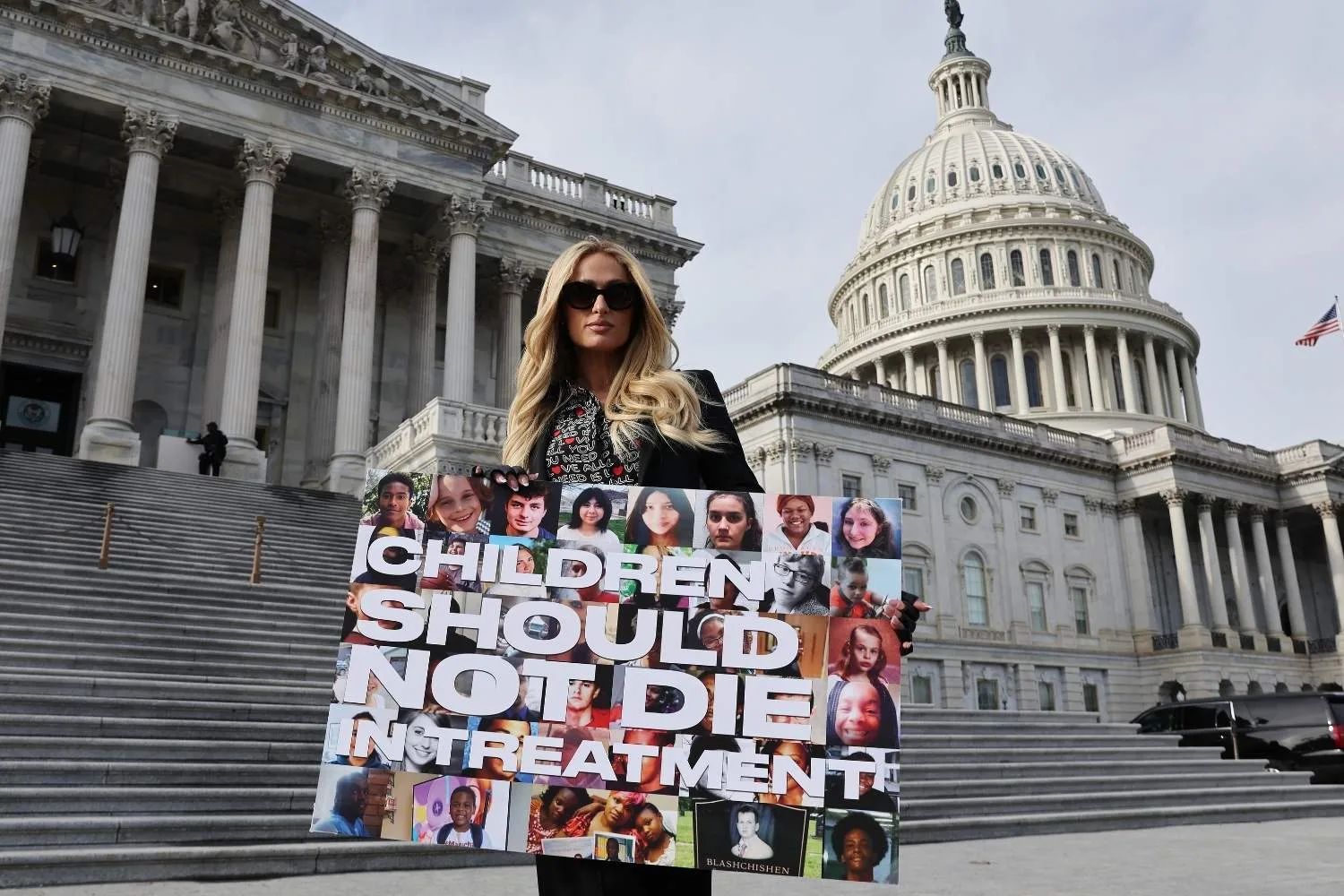 Paris Hilton on the steps of a government building.