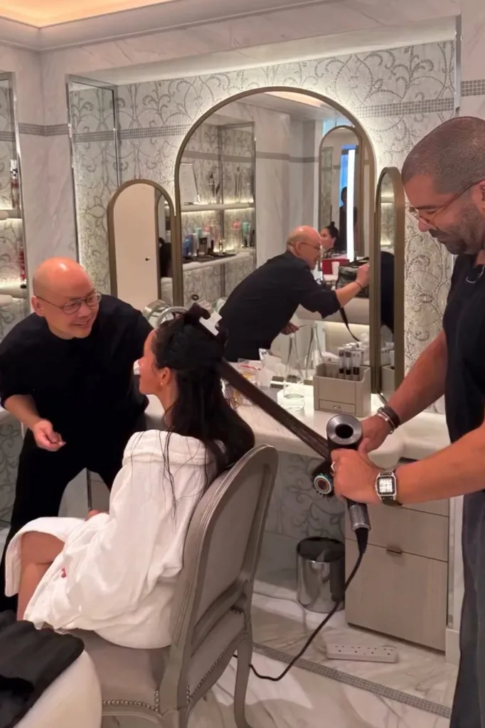 Meghan getting her makeup done at Paris Fashion Week