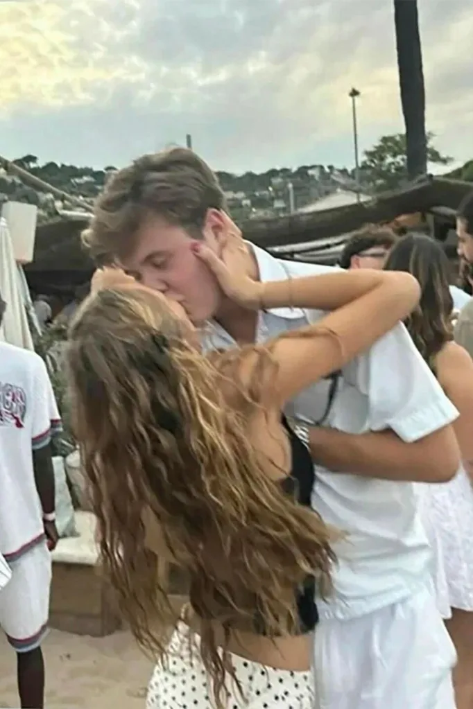 Crown Prince Christian and Emma kiss at a music festival