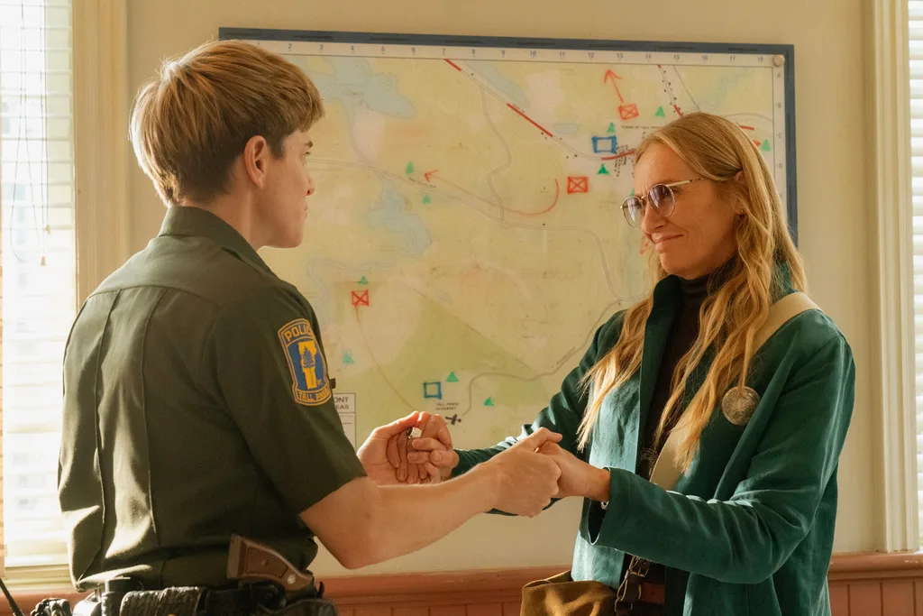 Mae Martin as a police officer and Toni Collette as her eccentric cult leader character