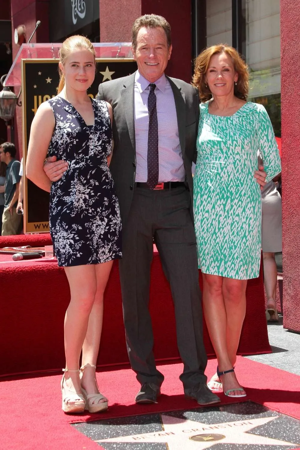 taylor dearden with parents posing