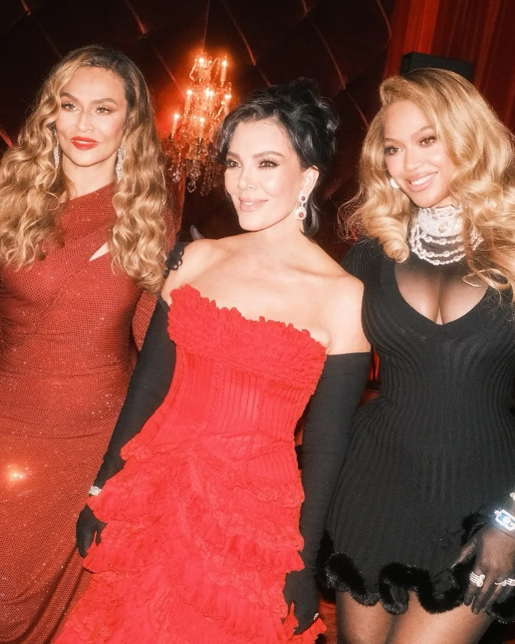 tina knowles with kris jenner and beyonce posing in glam outfits
