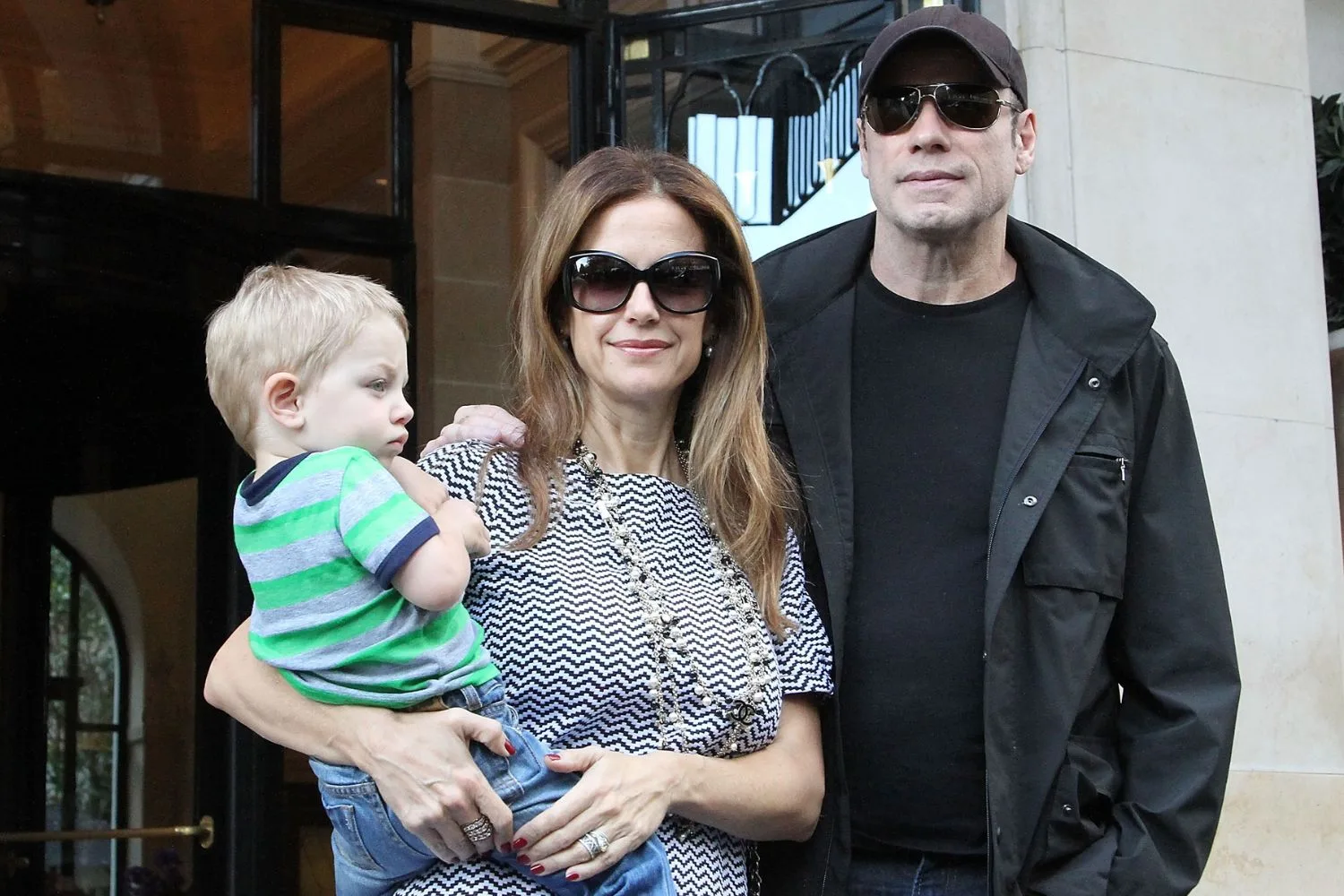 ohn Travolta, his wife Kelly Preston and their son Benjamin/Pic: Getty