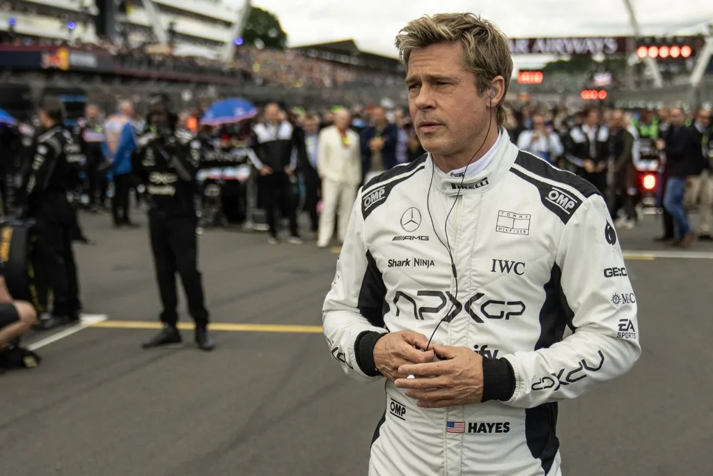 brad pitt in f1 racing suit looking concerned