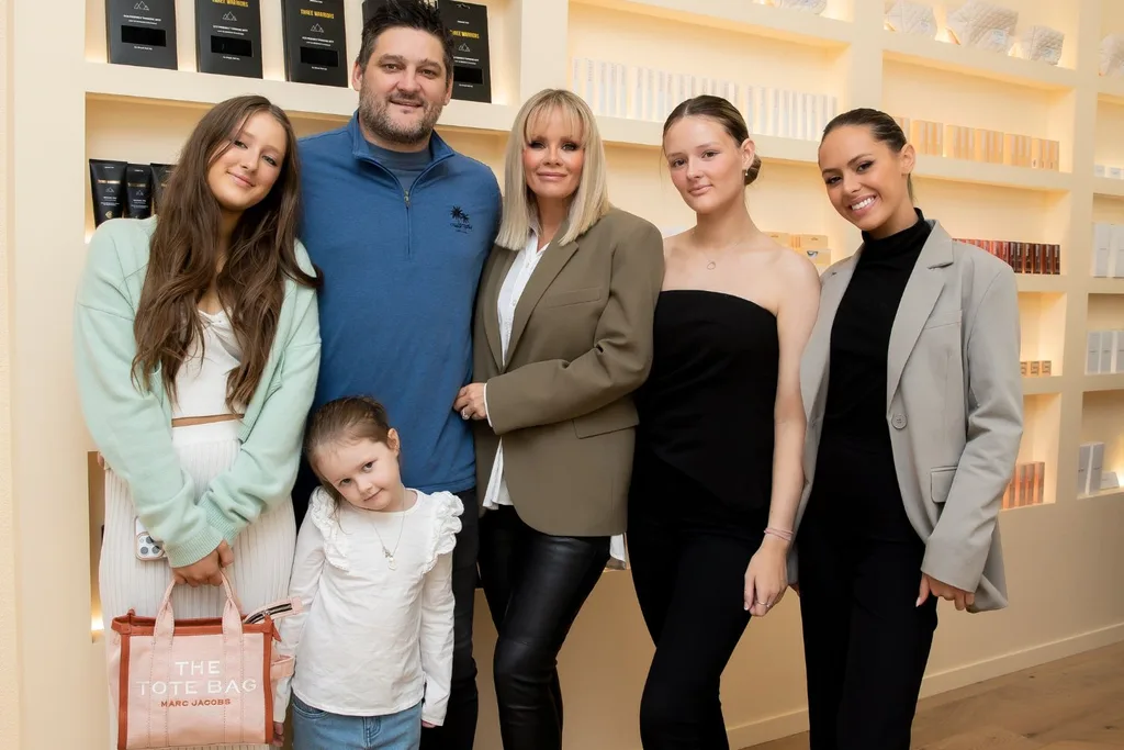 Brendan and Alex Fevola with their children.