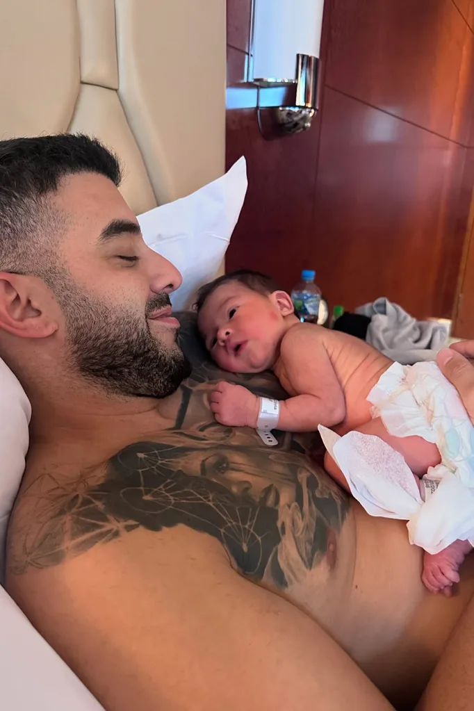 Adrian with his firstborn child Mercy.