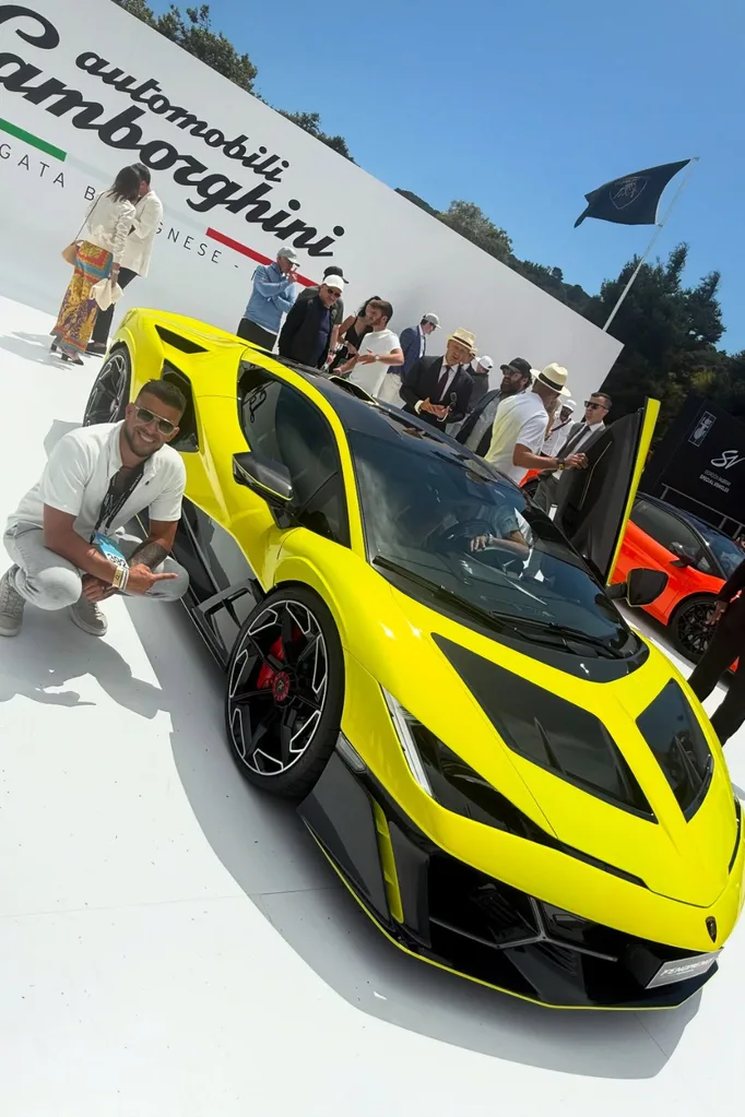 Adrian Portelli in front of a yellow Lamborghini.