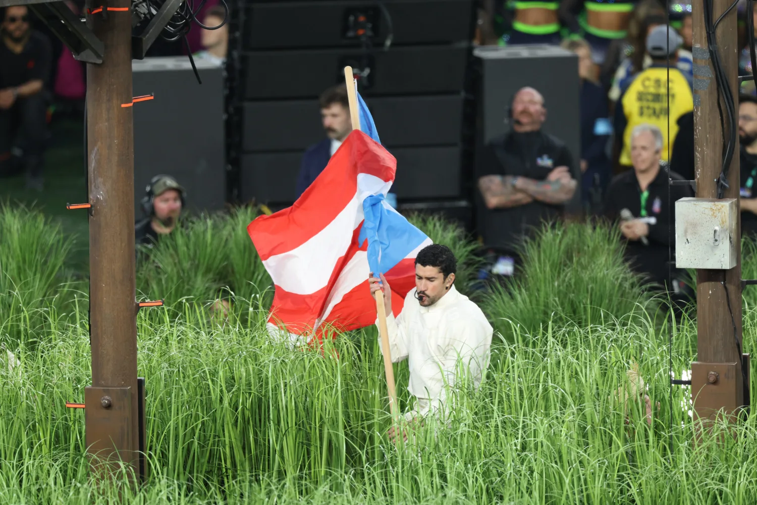 Bad Bunny holding the Puerto Rican flag during the Super Bowl Halftime Show. 