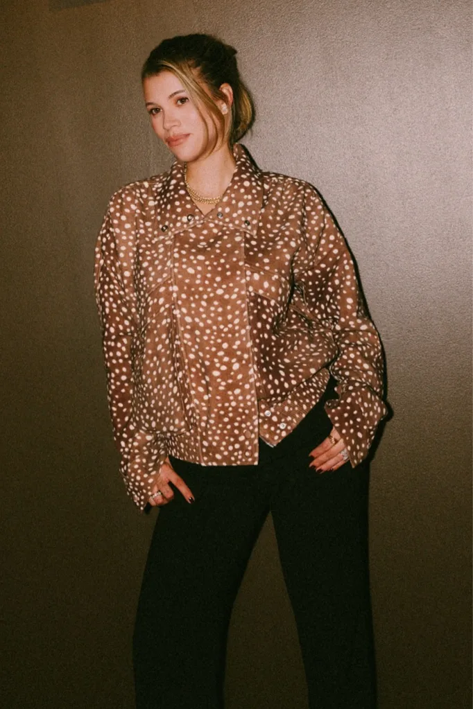 Animal Print: Sofia Richie Grainge posing in jenas and a deer print jacket