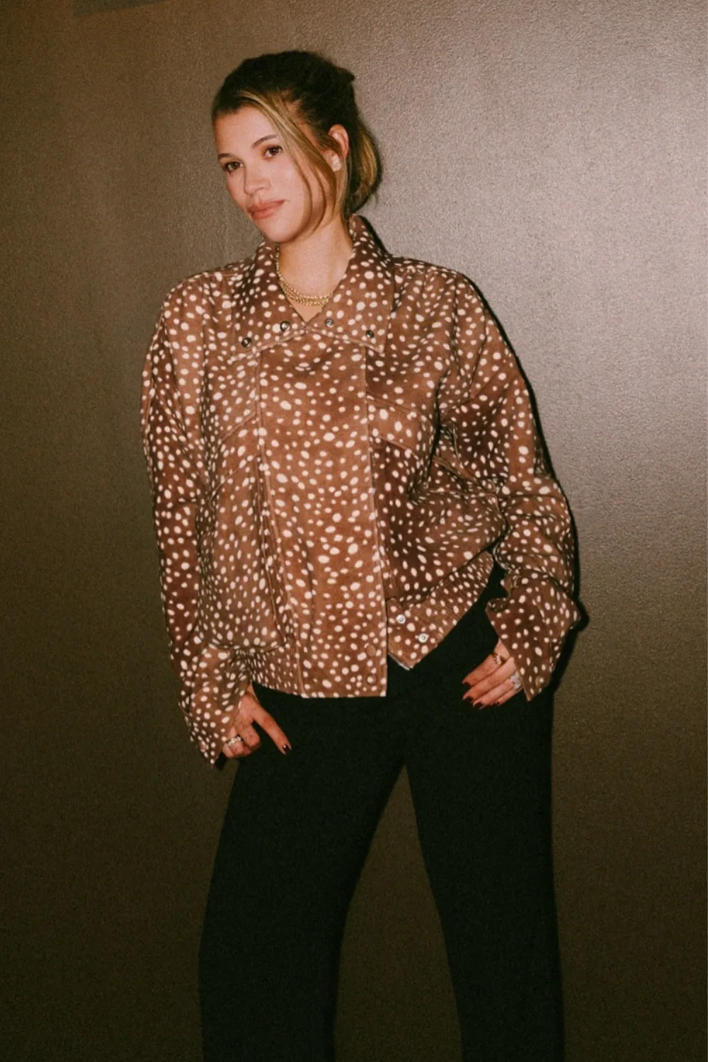 Animal Print: Sofia Richie Grainge posing in jenas and a deer print jacket