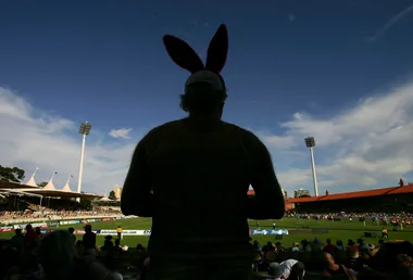 Man wearing Easter bunny ears at an AFL game in Australia.