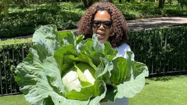 Oprah posing with cabbage.