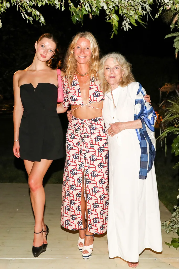 A younger, mid-life and elderly woman standing together