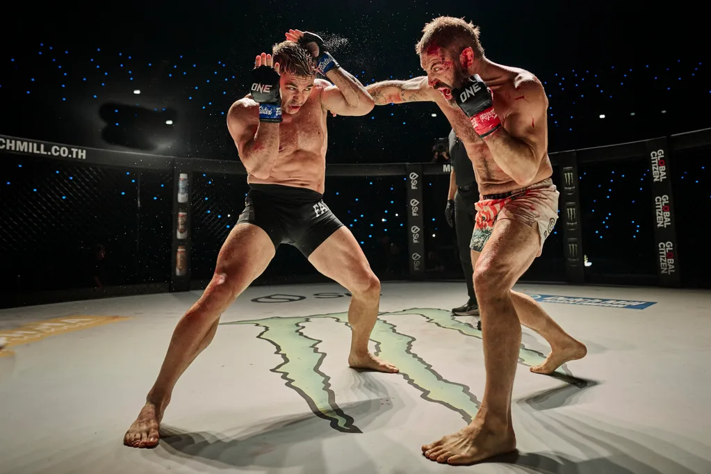 two men including daniel macpherson in the ring fighting
