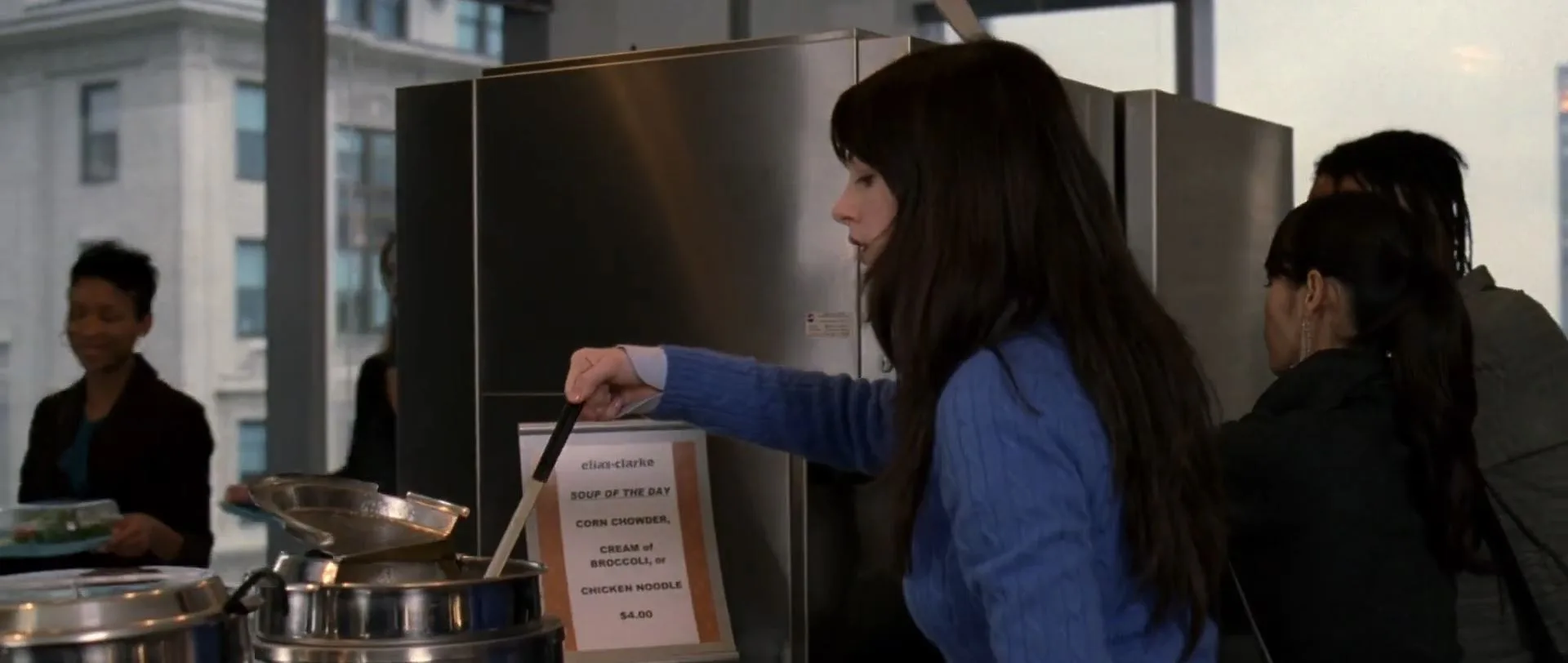 anne hathaway as andy scooping out some soup from a pot in devil wears prada 2