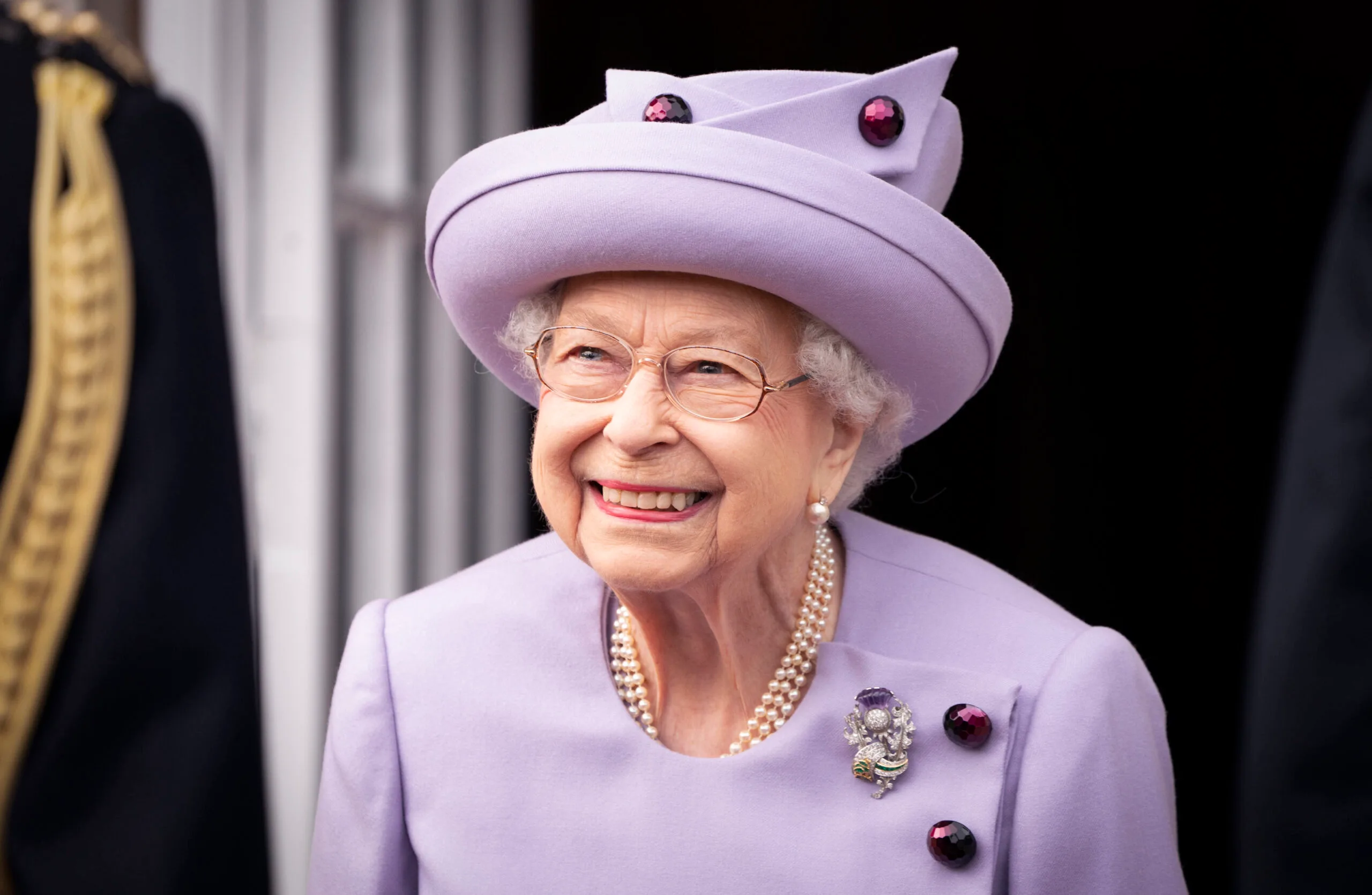 The Queen in a purple coat 