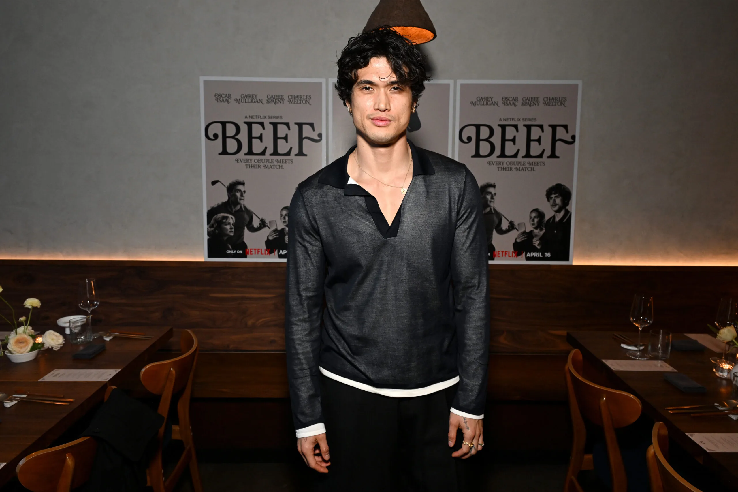 charles melton posing for a photo